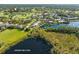 Wide aerial shot showcasing community on lake and golf course surrounded by picturesque scenery at 8984 Houston Pl # 103, Orlando, FL 32819