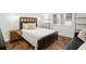 Cozy bedroom featuring a modern bed frame and decorative shelving at 8984 Houston Pl # 103, Orlando, FL 32819