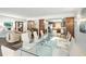 Open-concept dining area with ample seating, flowing into a comfortable and inviting living space at 8984 Houston Pl # 103, Orlando, FL 32819
