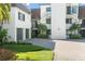 Elegant condo featuring manicured landscaping, brick driveway, and a contemporary design at 8984 Houston Pl # 103, Orlando, FL 32819