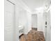 Bright hallway with stylish tile flooring and ample closet space at 8984 Houston Pl # 103, Orlando, FL 32819