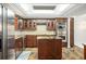 Well-appointed kitchen with custom cabinets, stainless appliances, and a functional center island at 8984 Houston Pl # 103, Orlando, FL 32819