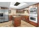 Stylish kitchen featuring stainless steel appliances, granite countertops, and custom cabinetry at 8984 Houston Pl # 103, Orlando, FL 32819
