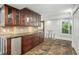 Charming kitchenette featuring custom cabinetry and a beverage center, perfect for entertaining at 8984 Houston Pl # 103, Orlando, FL 32819