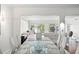 Bright, open-concept living room with modern furnishings and serene lake views at 8984 Houston Pl # 103, Orlando, FL 32819