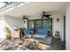 Relaxing covered patio with dual ceiling fans and comfortable seating at 8984 Houston Pl # 103, Orlando, FL 32819
