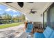 Relaxing covered patio with water views and outdoor seating area at 8984 Houston Pl # 103, Orlando, FL 32819