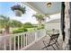 Peaceful front porch features hanging baskets and neighborhood views at 2584 Dividing Creek Path, The Villages, FL 32162