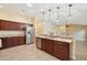 Well-equipped kitchen featuring stainless steel appliances and an island at 2584 Dividing Creek Path, The Villages, FL 32162