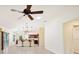 Open living space with high ceilings and a view into the kitchen at 2584 Dividing Creek Path, The Villages, FL 32162