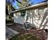 Rear exterior view of a single-story home with an installed air conditioning system at 709 N Lincoln Ave, Lakeland, FL 33815