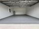 Clean and spacious garage with epoxy floor and overhead storage at 6208 Sw 129Th St, Ocala, FL 34473