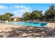 Spacious community pool surrounded by lush trees provides a serene retreat at 476 Banyon Tree Cir # 104, Maitland, FL 32751