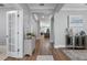 Inviting hallway with hardwood floors, elegant decor and light grey wall paint at 772 Stephens Pass Cv, Lake Mary, FL 32746