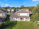 A beautiful home featuring a tiled roof, rear patio, and an expansive grassy lawn at 772 Stephens Pass Cv, Lake Mary, FL 32746