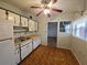 Cozy kitchen with white cabinets and a laminate countertop at 919 Timor Ave, Orlando, FL 32804