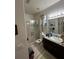 Bathroom with shower, toilet, and dark vanity at 2800 Tropic Ct, Winter Garden, FL 34787