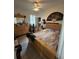 Large bedroom with a king-size bed and wood dresser at 2800 Tropic Ct, Winter Garden, FL 34787