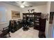 Home office with built-in shelving and wood desk at 2800 Tropic Ct, Winter Garden, FL 34787