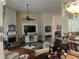 Open living room featuring hardwood floors and a fireplace at 2800 Tropic Ct, Winter Garden, FL 34787