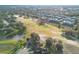 Aerial view of a residential area adjacent to a golf course at 496 Mile Post Ct, Lake Mary, FL 32746