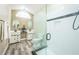 Modern bathroom with double sinks, a large shower, and updated flooring at 496 Mile Post Ct, Lake Mary, FL 32746