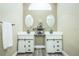 Double vanity bathroom with updated fixtures and flooring at 496 Mile Post Ct, Lake Mary, FL 32746