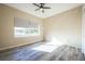 Bright bedroom with ceiling fan and hardwood floors at 496 Mile Post Ct, Lake Mary, FL 32746