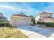 Front view of house and driveway at 496 Mile Post Ct, Lake Mary, FL 32746