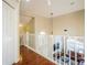 Upper-level hallway offering a view of the living room below at 496 Mile Post Ct, Lake Mary, FL 32746