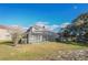 Backyard view of two-story house with screened pool at 496 Mile Post Ct, Lake Mary, FL 32746