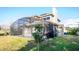 Rear view of home, highlighting pool and screened enclosure at 496 Mile Post Ct, Lake Mary, FL 32746