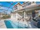 Home exterior showcasing a large pool and screened enclosure at 496 Mile Post Ct, Lake Mary, FL 32746