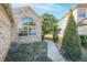 Landscaped walkway leading to home entrance at 496 Mile Post Ct, Lake Mary, FL 32746