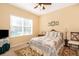 Cozy bedroom with a queen-size bed and large window at 10063 Malmsbury Rd, Orlando, FL 32829