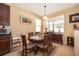 Charming dining room with round table and window seating at 10063 Malmsbury Rd, Orlando, FL 32829