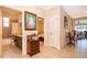 Bright hallway with tile floors, leading to bedroom and bathroom at 10063 Malmsbury Rd, Orlando, FL 32829