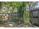 Private backyard with wooden fence and patio area at 543 Warrenton Rd # 543, Winter Park, FL 32792