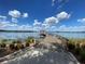 Picturesque lake view with a wooden pier and gazebo at 543 Warrenton Rd # 543, Winter Park, FL 32792