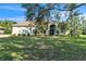 Single-story house with a well-maintained lawn and landscaping at 9868 Montclair Cir, Apopka, FL 32703