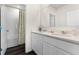 Bright bathroom with double vanity, quartz countertops, and modern fixtures at 5511 Stable Mate Dr, Apopka, FL 32712