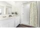 Bathroom featuring double sink vanity and walk-in shower with modern hardware at 5511 Stable Mate Dr, Apopka, FL 32712