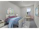Cozy bedroom with playful decor, featuring a comfortable bed and fun accents at 5511 Stable Mate Dr, Apopka, FL 32712