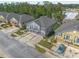 Aerial view of townhomes with two-car garages and landscaped front yards at 3010 San Jacinto Cir # 3010, Sanford, FL 32771