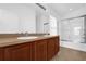 Bathroom with a double sink vanity and a shower and bath combo with a glass door at 3010 San Jacinto Cir # 3010, Sanford, FL 32771