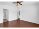 Spacious room with wood floors and ceiling fan with access to an on-suite bathroom at 3010 San Jacinto Cir # 3010, Sanford, FL 32771