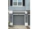 Garage door with lights and the address number '3010' above the door at 3010 San Jacinto Cir # 3010, Sanford, FL 32771