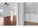 Bright living room with hardwood floors and a laundry closet with a washer and dryer at 3010 San Jacinto Cir # 3010, Sanford, FL 32771