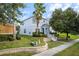 Charming two-story home with blue siding, landscaped yard, mature trees, and inviting curb appeal at 621 Brandy Oaks Loop, Winter Garden, FL 34787