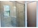 Modern bathroom shower area with glass door and wall tile at 1173 Basalt Ln, Sanford, FL 32771